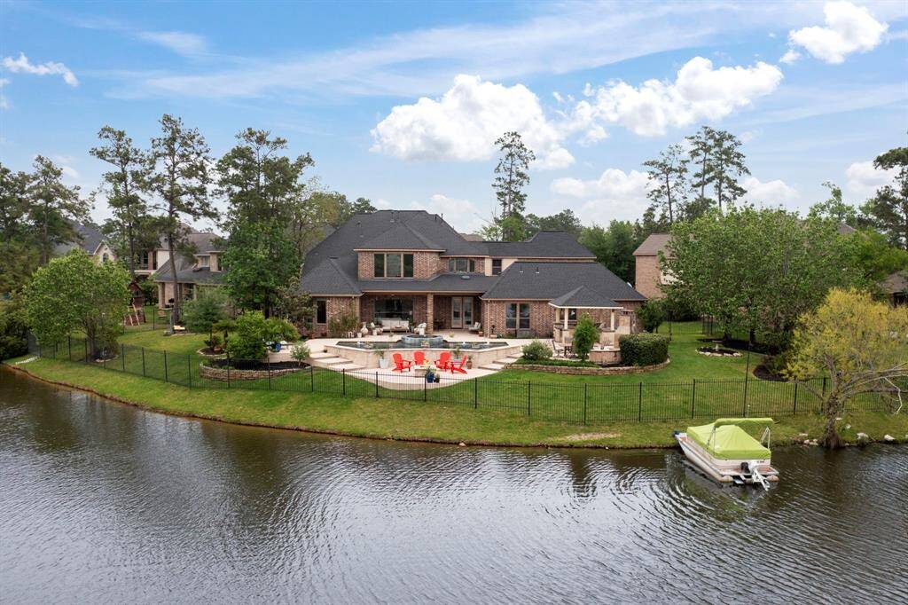 Whether you're floating in the pool, soaking in the spa, or simply lounging on the deck, the serene lake view creates a backdrop of pure peace and beauty. This is more than just a backyard—it’s a resort-style oasis where every moment feels like a getaway.