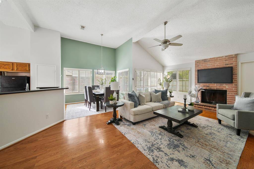 Imagine the sounds of laughter and chatter as you create lasting memories in this beautiful home. Featuring soft neutral finishes like hardwood and tile flooring, designer paint, updated lighting and fans, wood-shuttered windows, and plenty of space to entertain or unwind, you’ll truly love calling this place home.