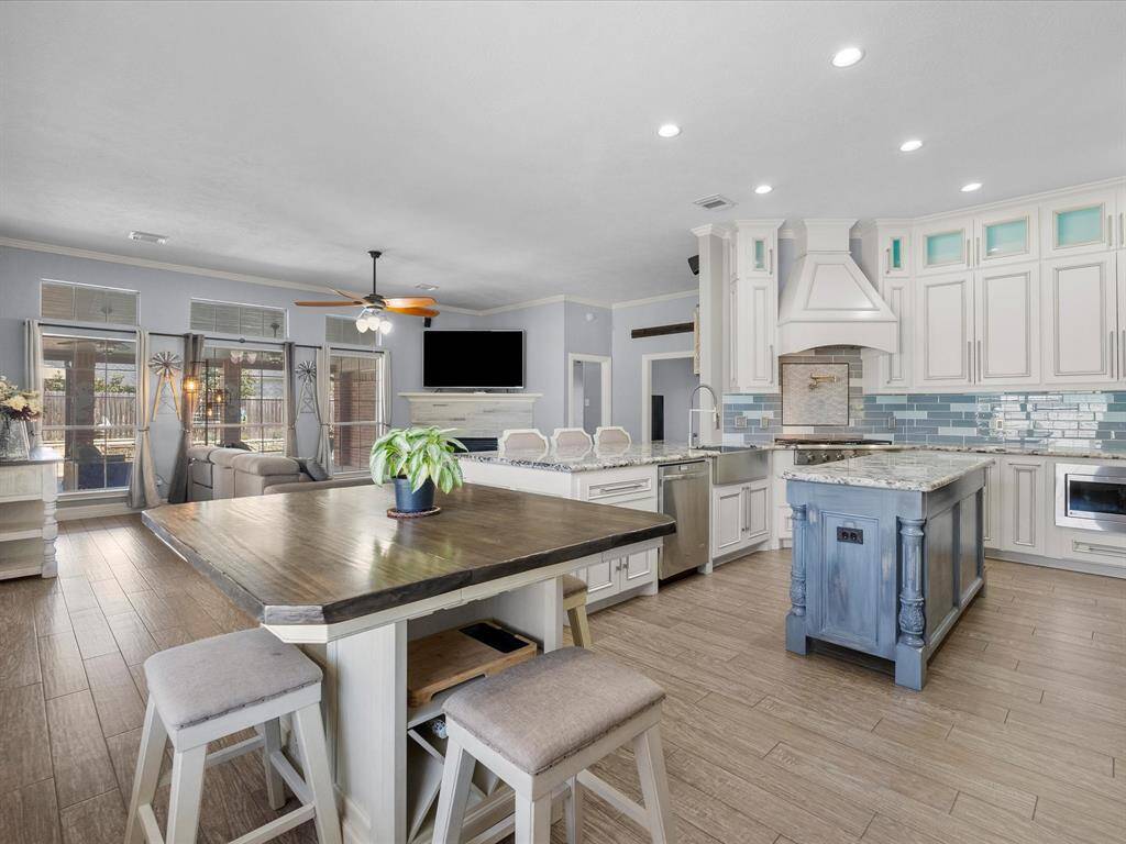 The large kitchen area has a large island centrally located.