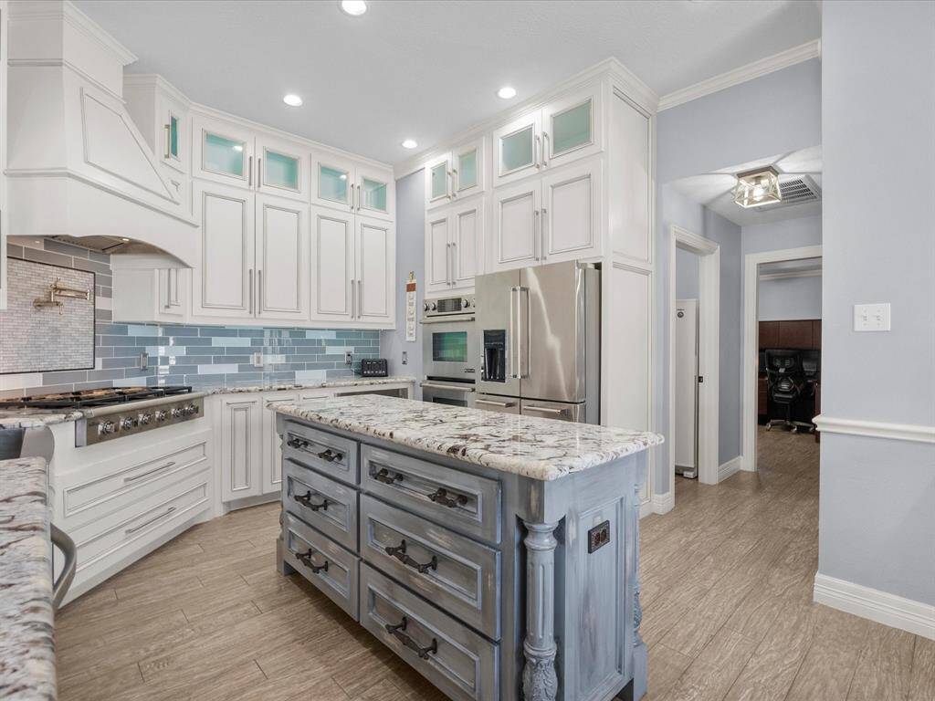 The kitchen has plenty of storage space and has a large pantry adjacent to the area