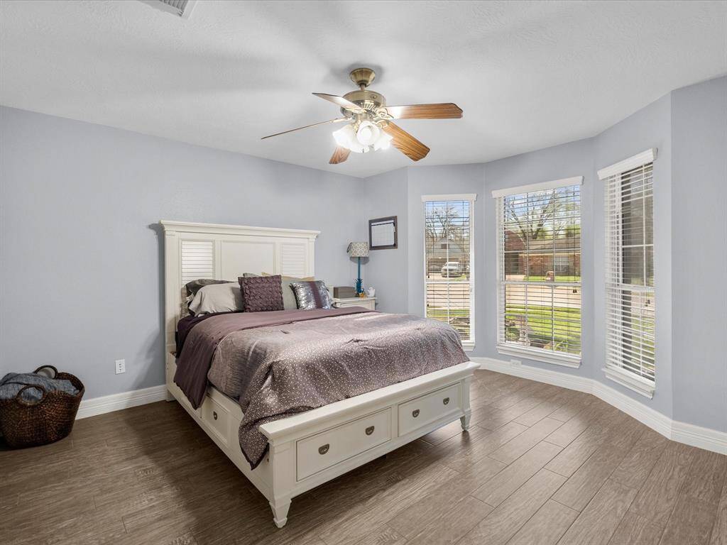 Bright and airy bedroom with a bay window.