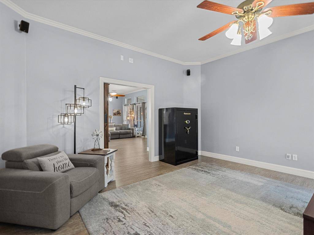The family/game room is bright, airy and has access to main living space.
