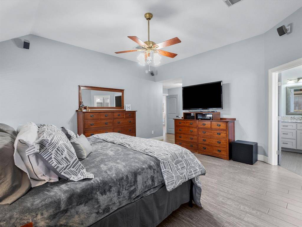 Bedroom is well lit and spacious.