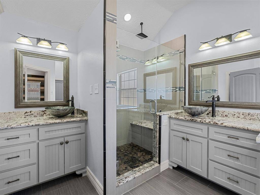 The custom en-suite has large shower with overhead rain shower.