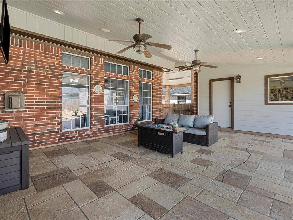 The covered patio also provides access to the cavernous garage/workshop