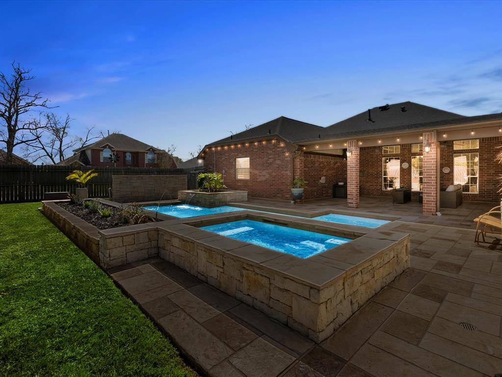 Custom backlit yard with spa.