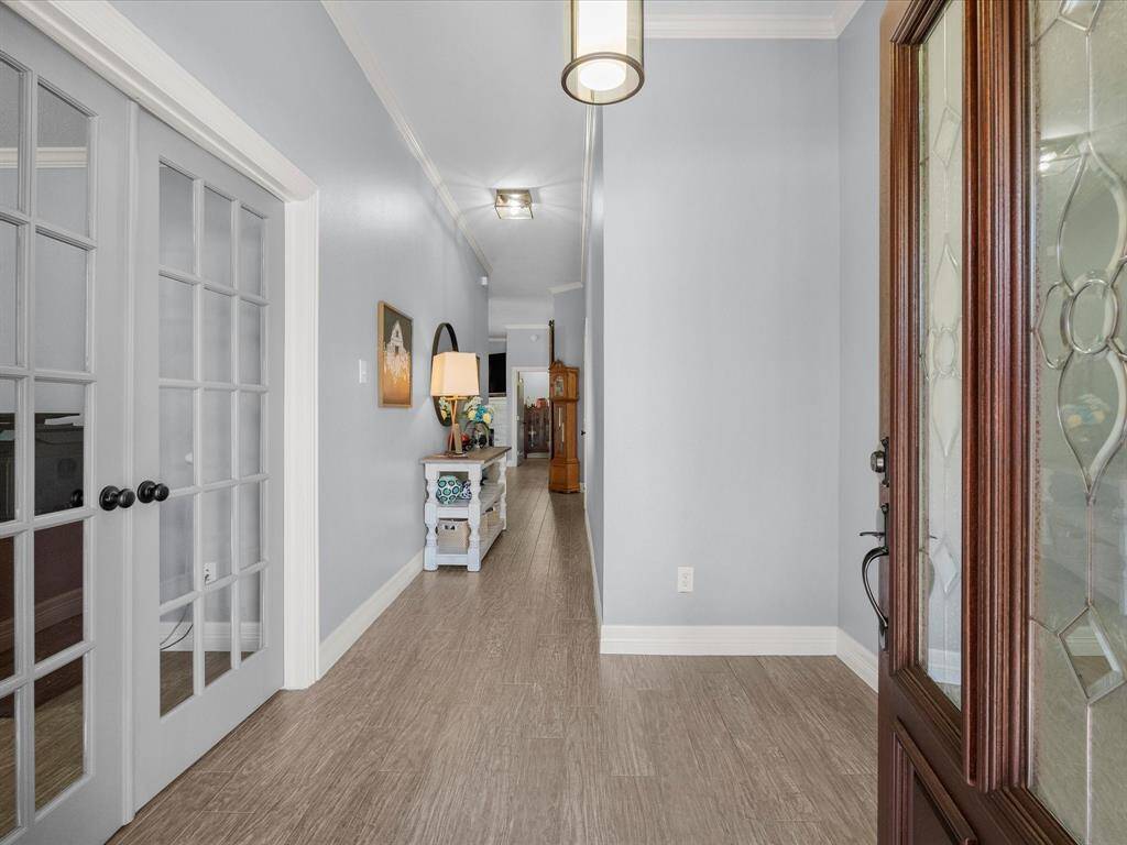 Entryway to the house. Throughout the property there are custom five-inch baseboards.