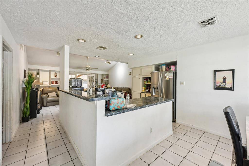 Kitchen is perfectly located in the center- great for hosting!