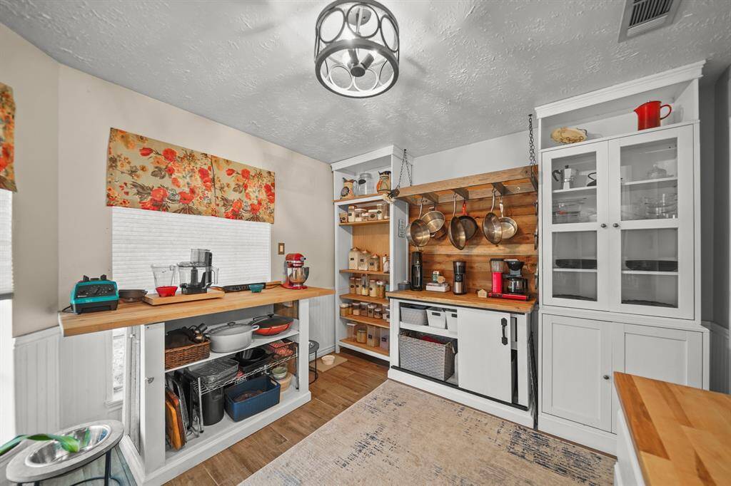 If you like rustic, you'll love this kitchen with lots of storage space.