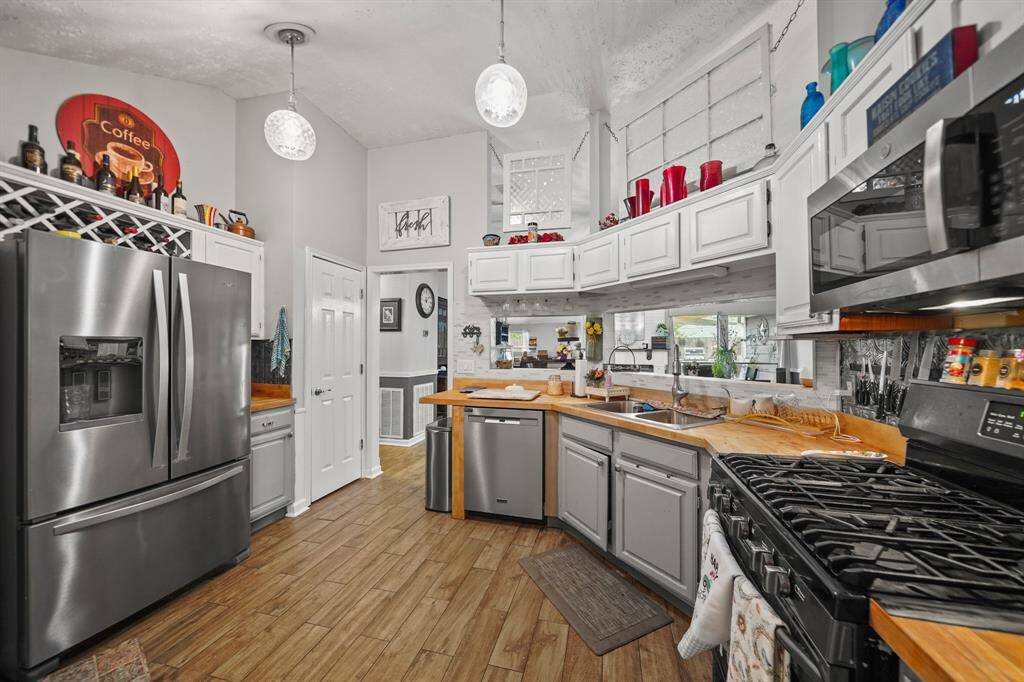 Stainless steel refrigerator remains with property.  Pantry is door to left of dishwasher