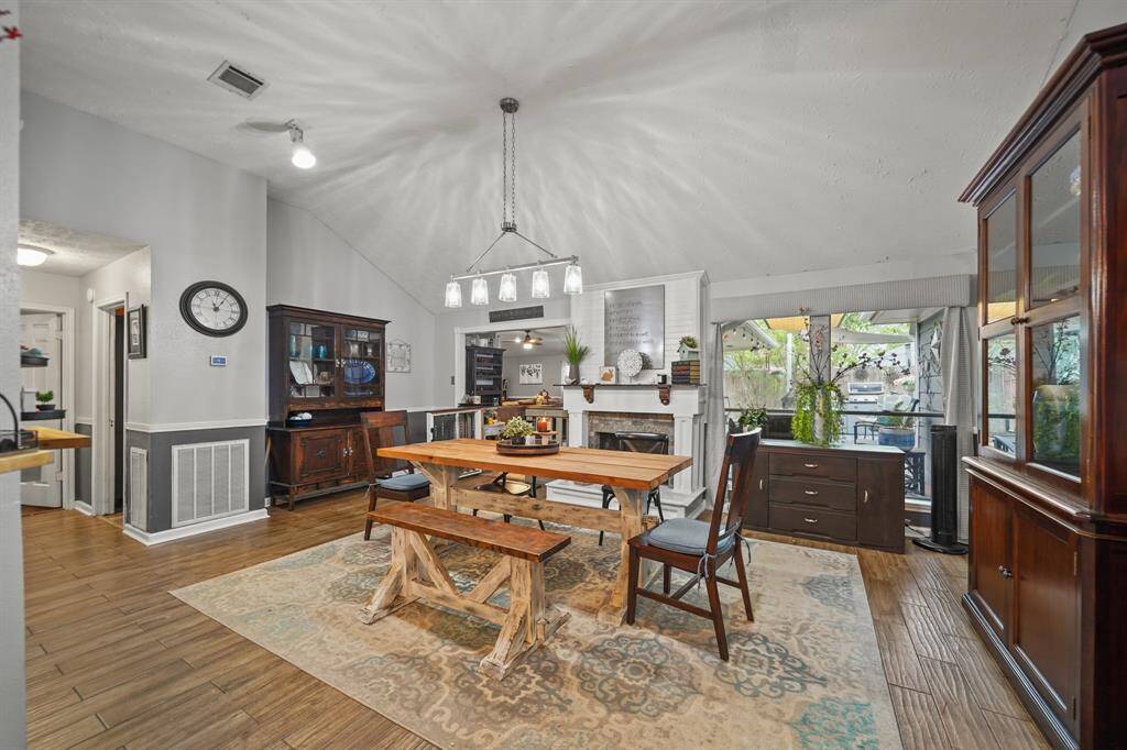 Take a look at this amazing dining area featuring a vaulted ceiling. The table and benches were handcrafted by the homeowner, and if you would like, they can be left for you.