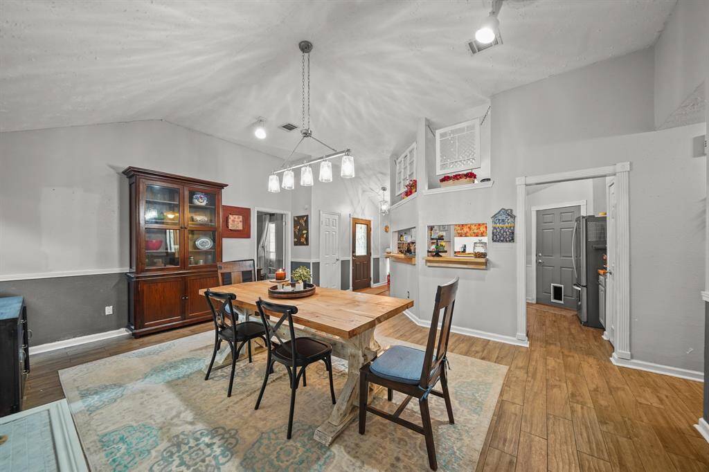 Another view of the vaulted ceiling in the dining room.  Very roomy for entertaining friends and family.