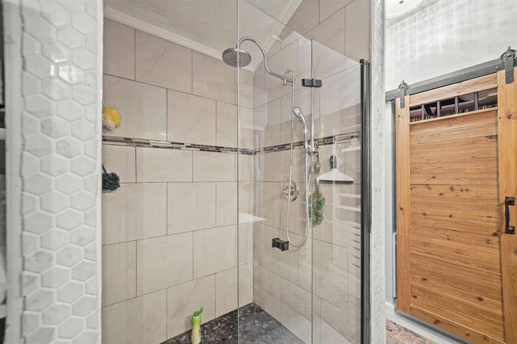 Larger view of the shower with glass panels