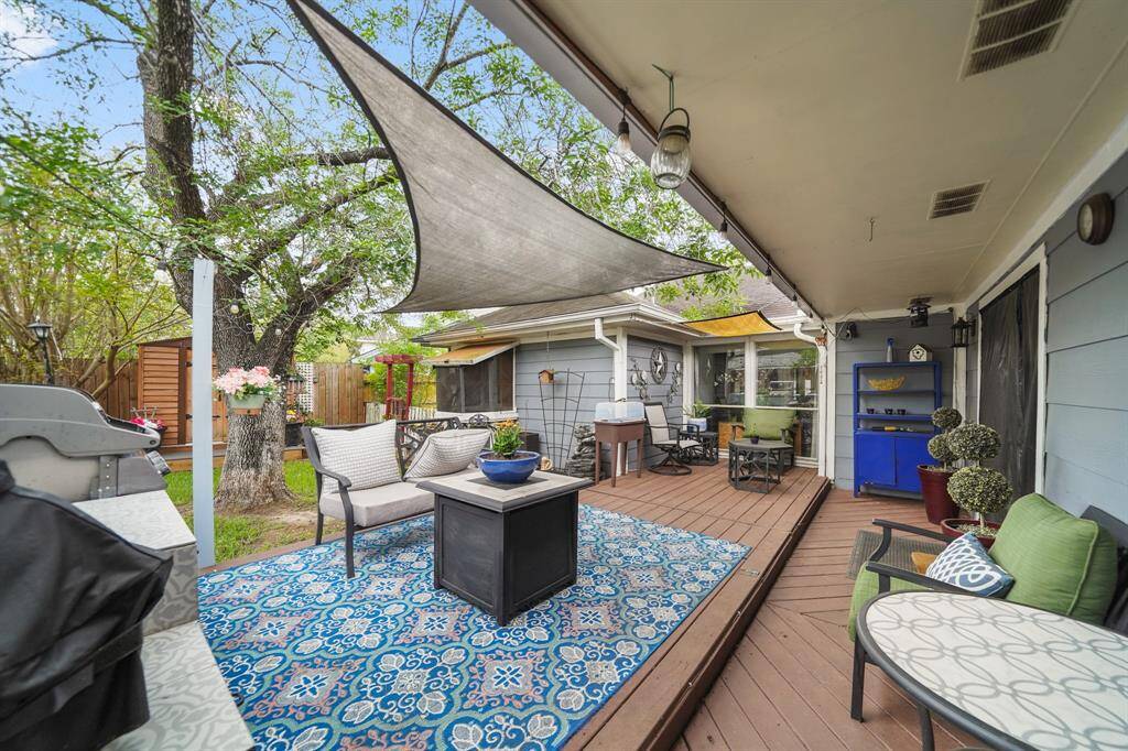 Large patio with mature trees in back  Great for putting out a table and serving friends and family for holidays!