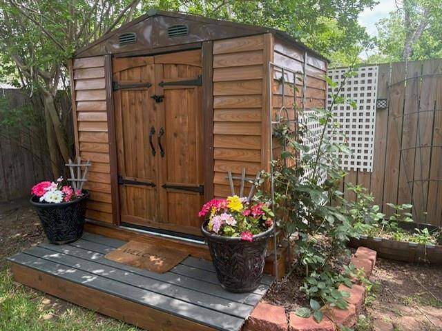 Planters with flowers to remain with She Shed