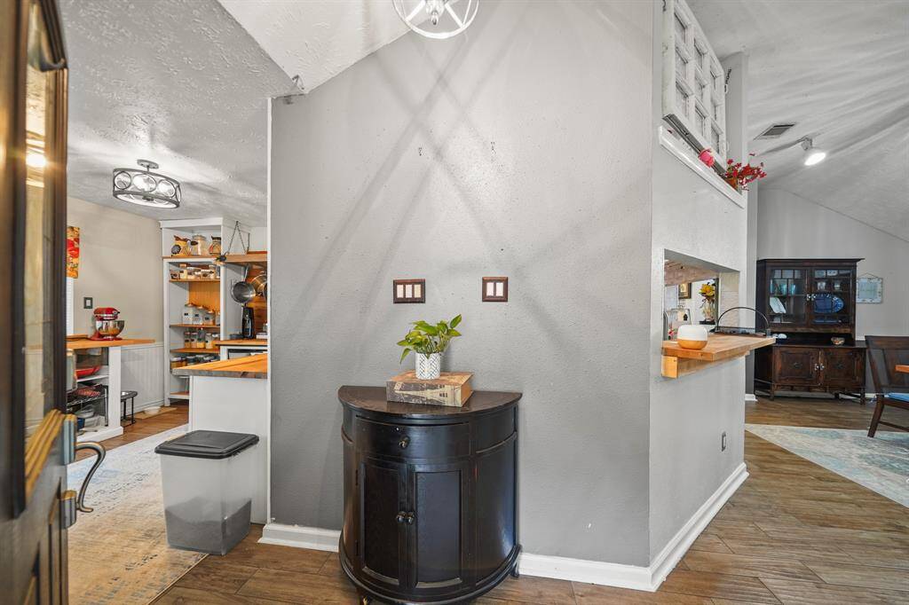 As you enter, notice the neutral paint and manufactured wood floors.
