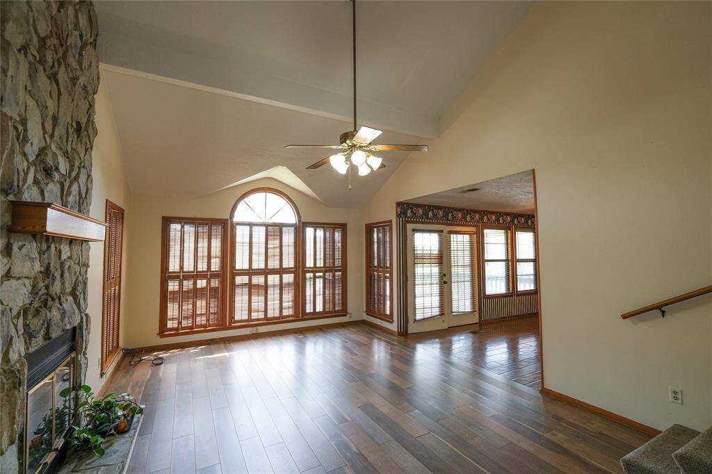 Living area with tall ceilings and offering plenty of natural light