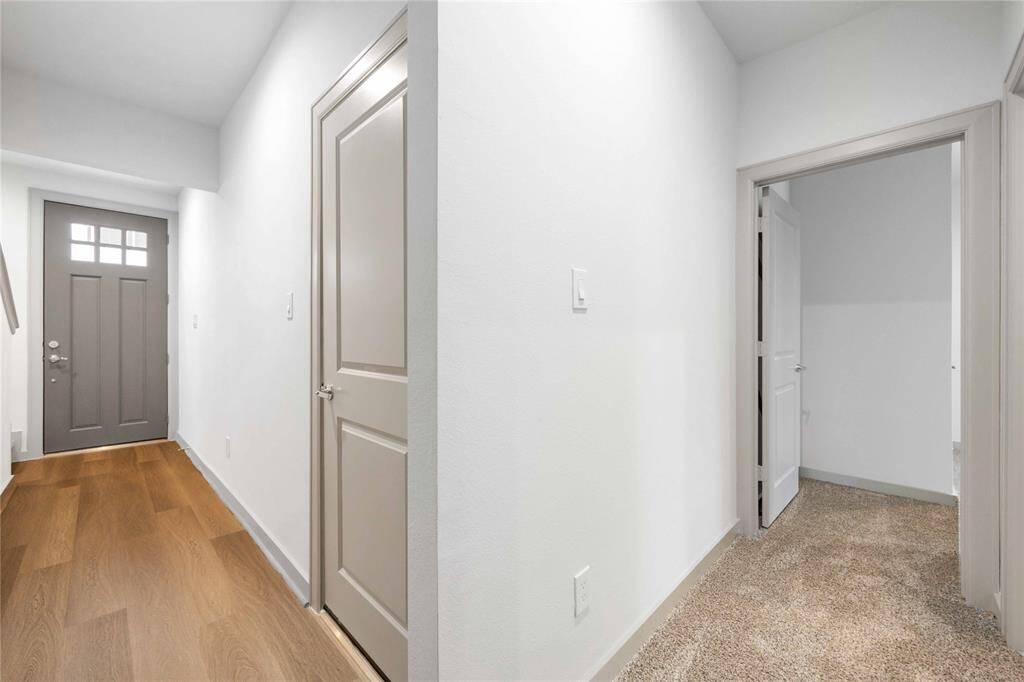 View of entry and downstairs guest bedroom