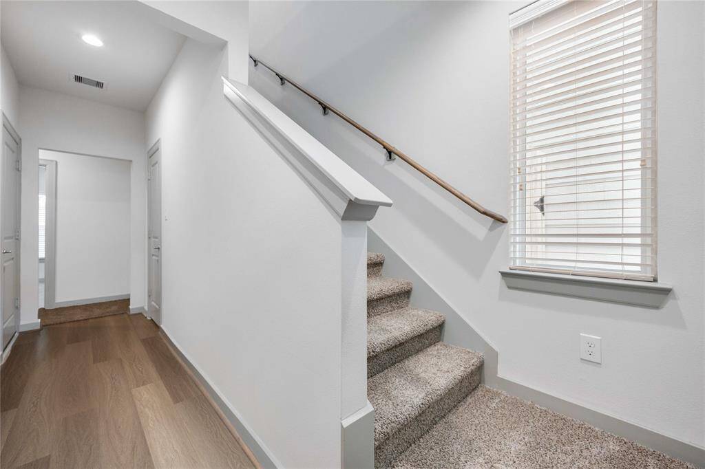 Entry to the downstairs rooms and stairs leading to the second floor
