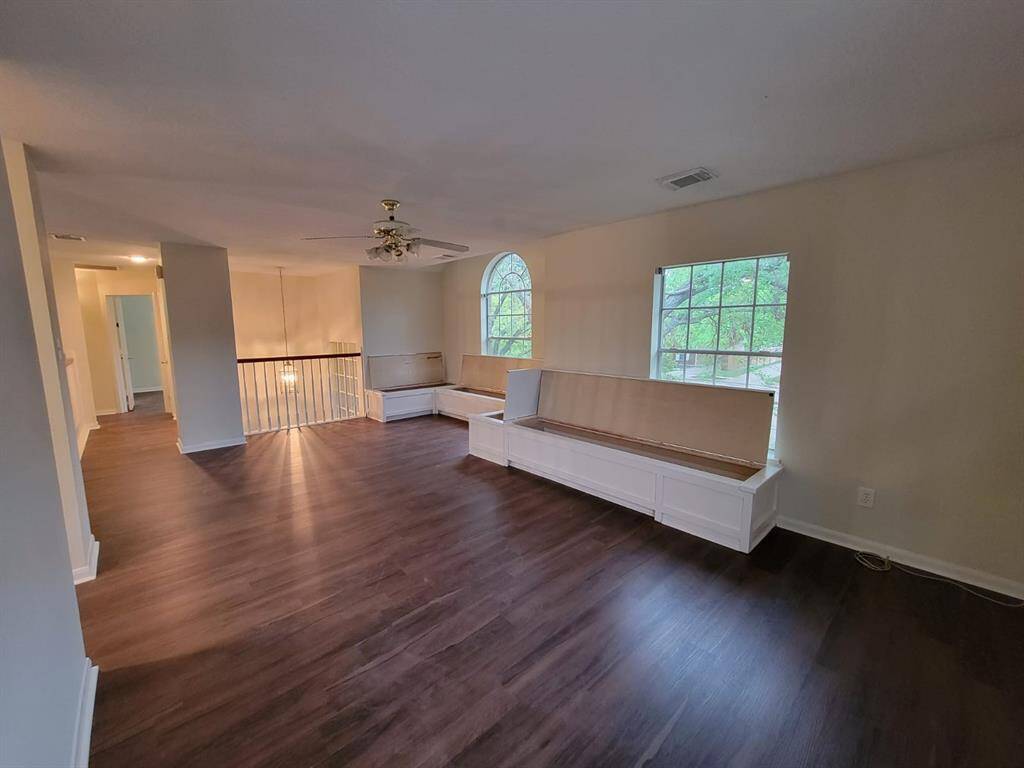 Upstairs open-loft style game room with plenty of storage offered