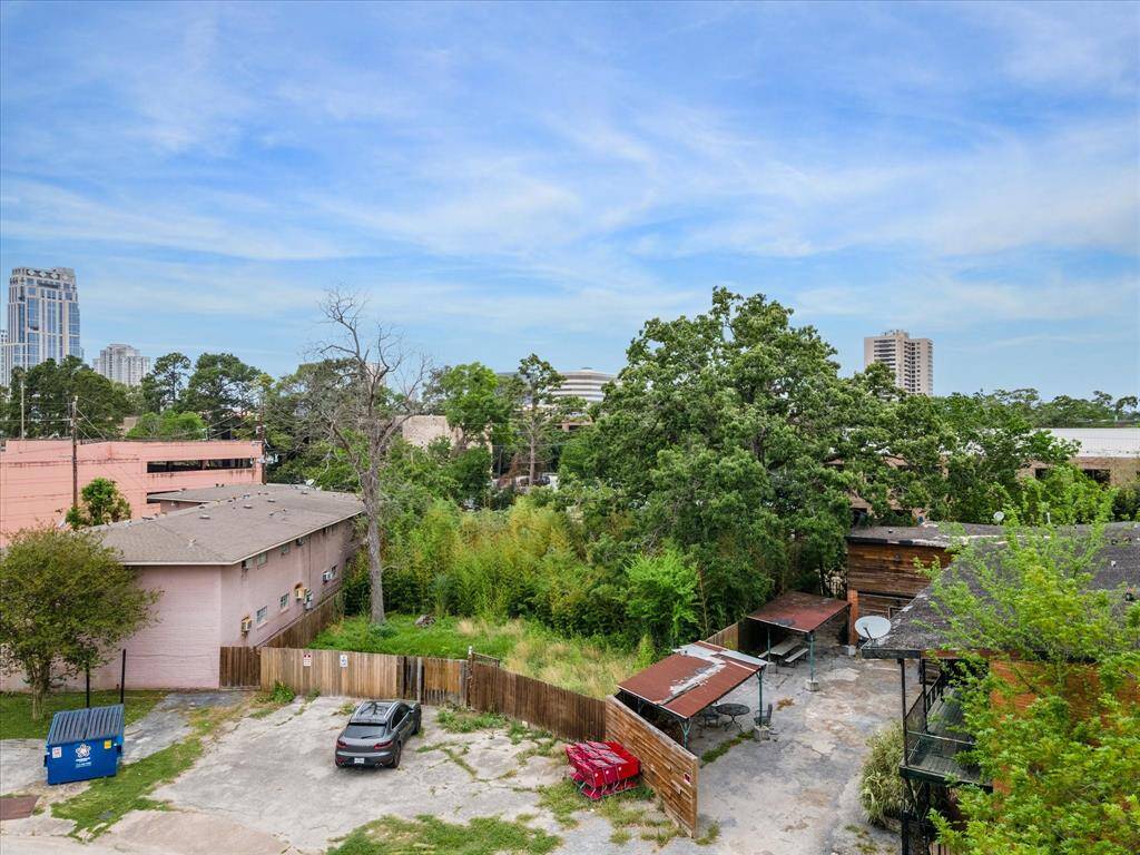 Property is located to the left of the pink building