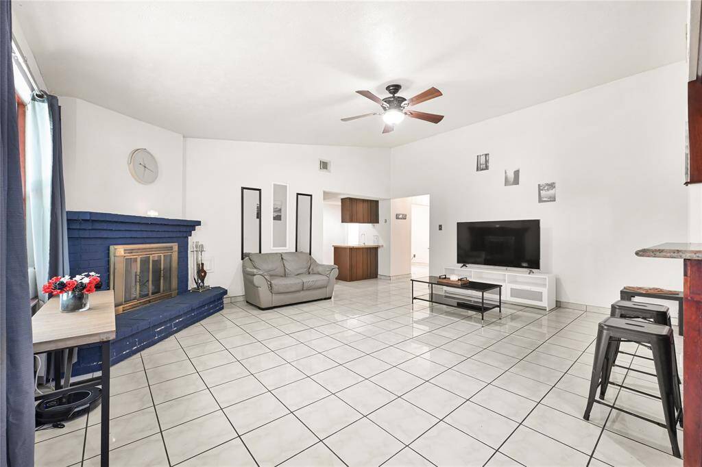 Another view of living area with wet bar.