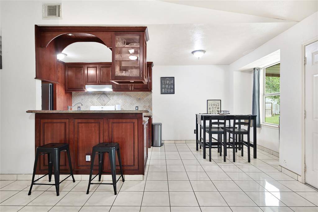 View of breakfast and kitchen area.