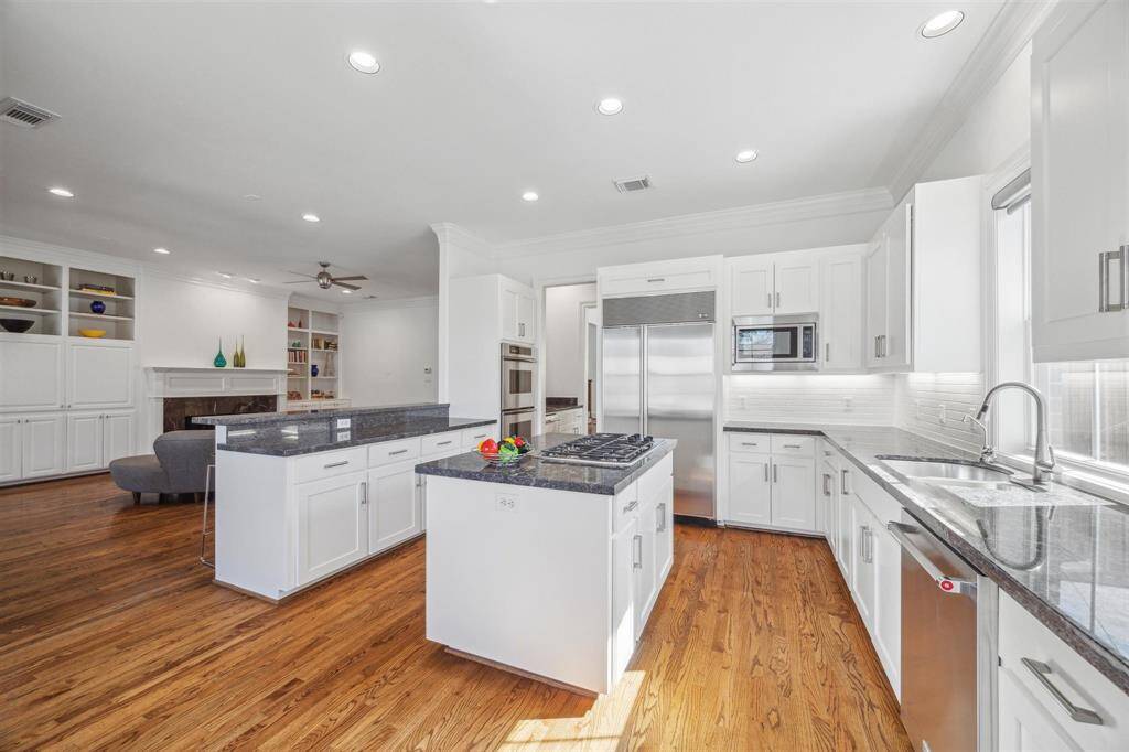 High end stainless appliances: SubZero refrigerator/freezer, Thermador double ovens and recent dishwasher
