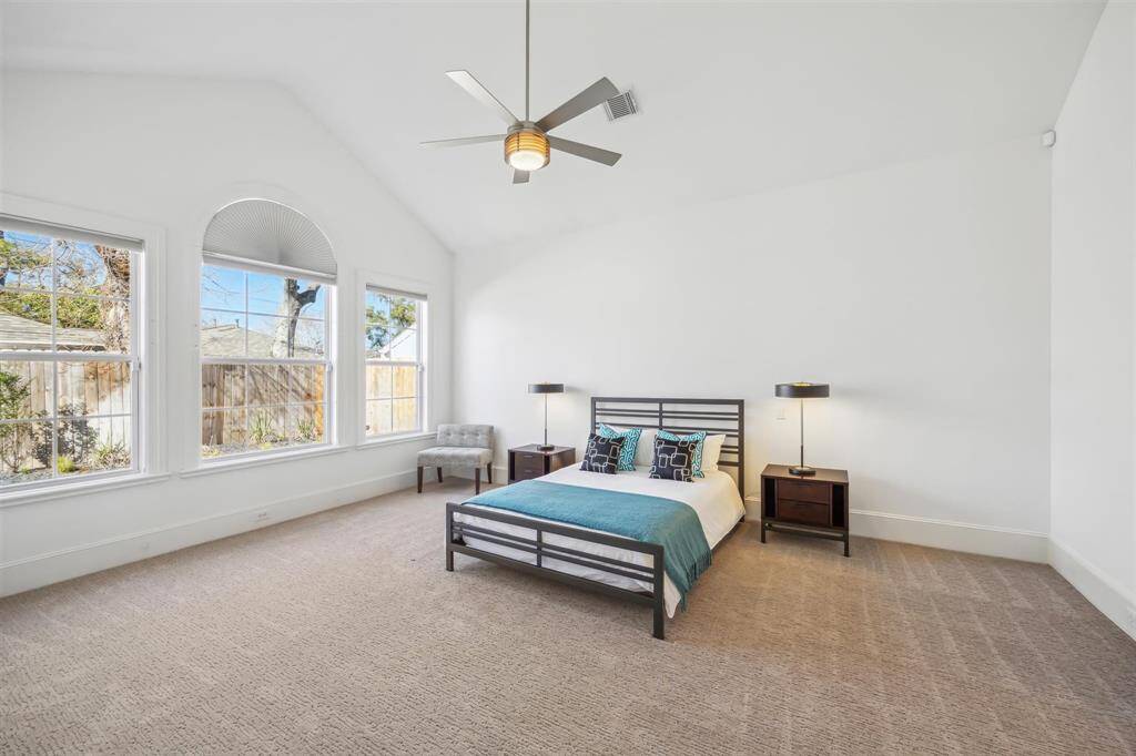 Downstairs primary bedroom with vaulted ceiling