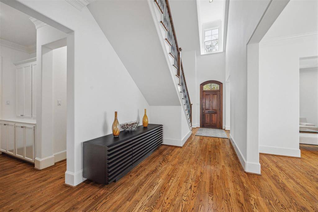 Foyer with high ceiling and hardwoods
