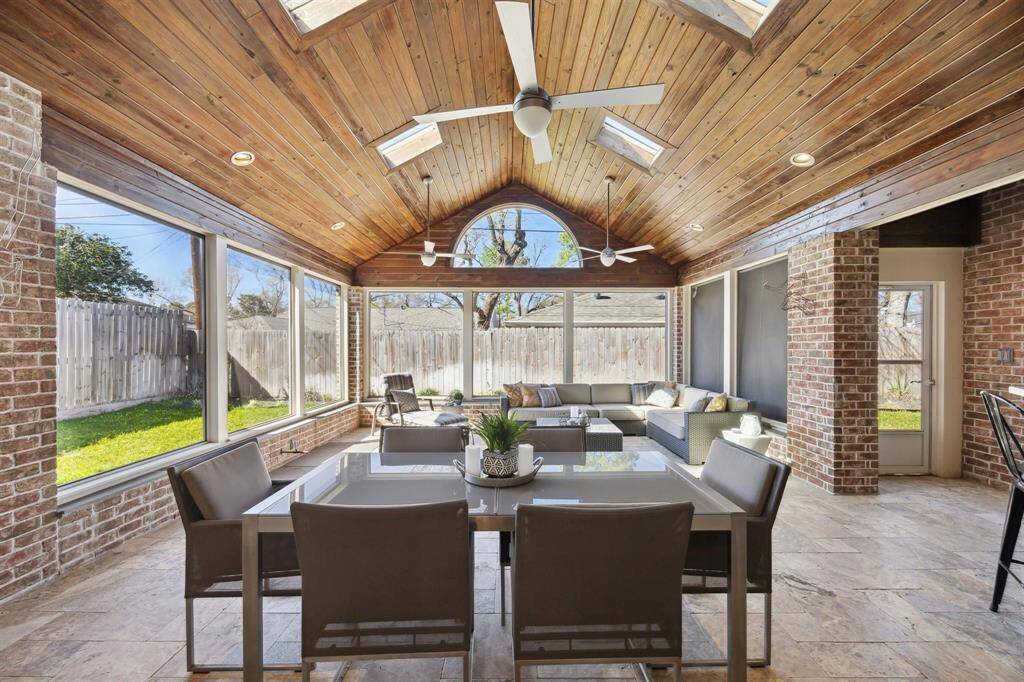 The screened-in patio provides additional dining and living space...perfect for entertaining also!