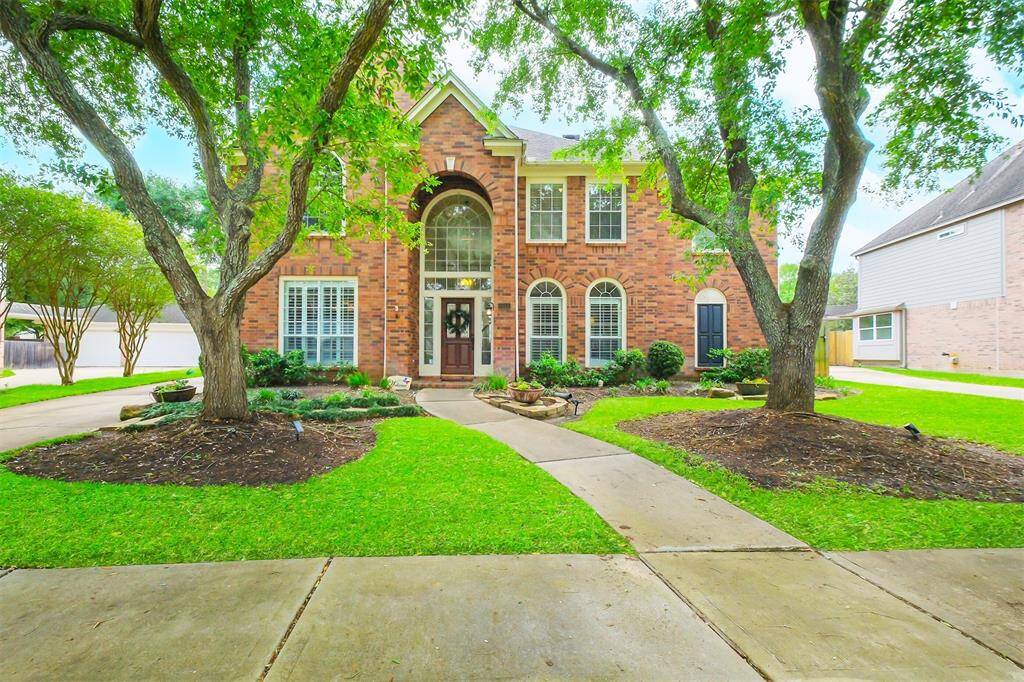 WELCOME TO 6911 CHESSLEY CHASE DRIVE IN THE HEART OF NEW TERRITORY - A STUNNING 4-BEDROOM, 3.5-BATH BRICK HOME FEATURING A 2-CAR DETACHED GARAGE AND CHARMING CURB APPEAL.