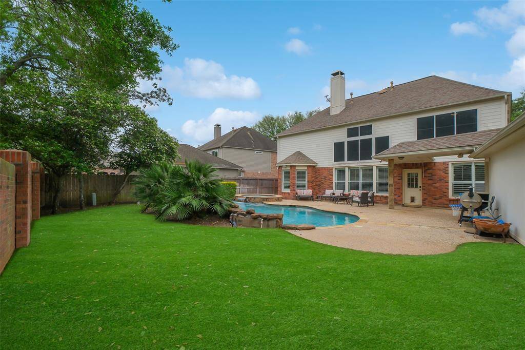 THIS SPACIOUS BACKYARD OFFERS PLENTY OF ROOM FOR PETS TO RUN AND PLAY.