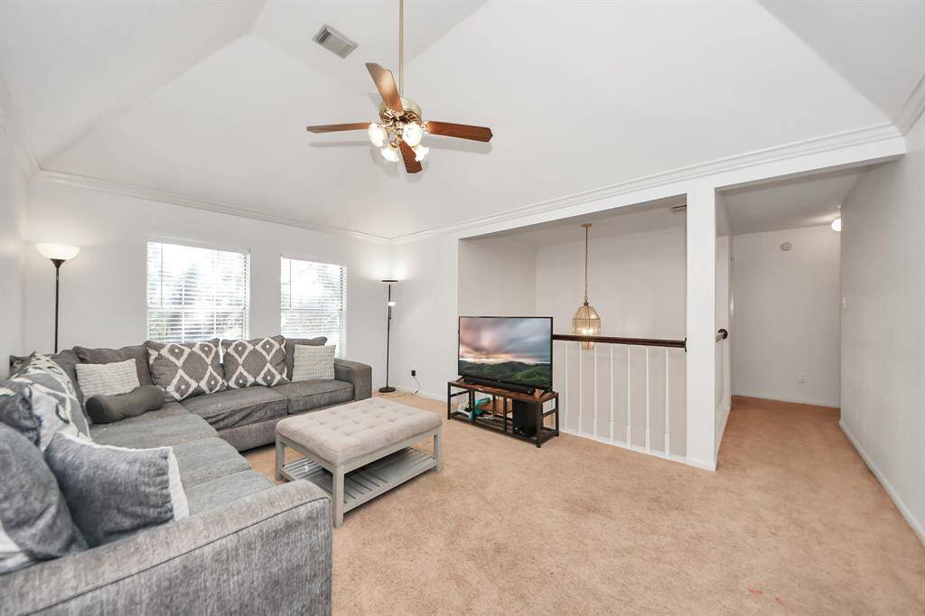 Light and bright game room at the top of the stairs is the perfect spot for toys, games, books and more.