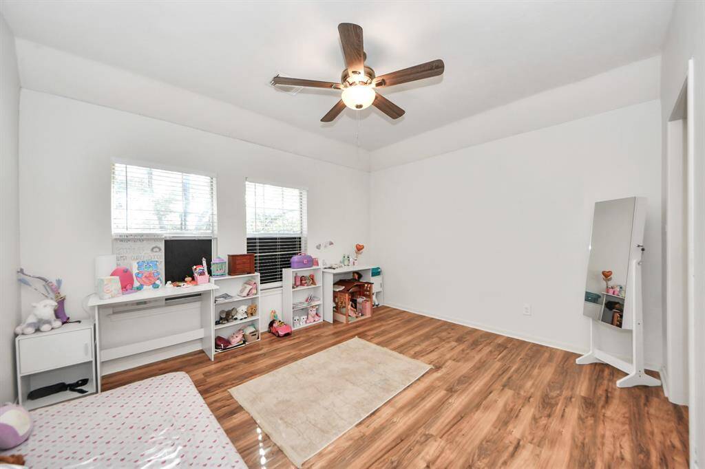 Large bedroom with higher ceilings shares Jack and Jill bath with adjacent bedroom. Nice sized walk in closet here!