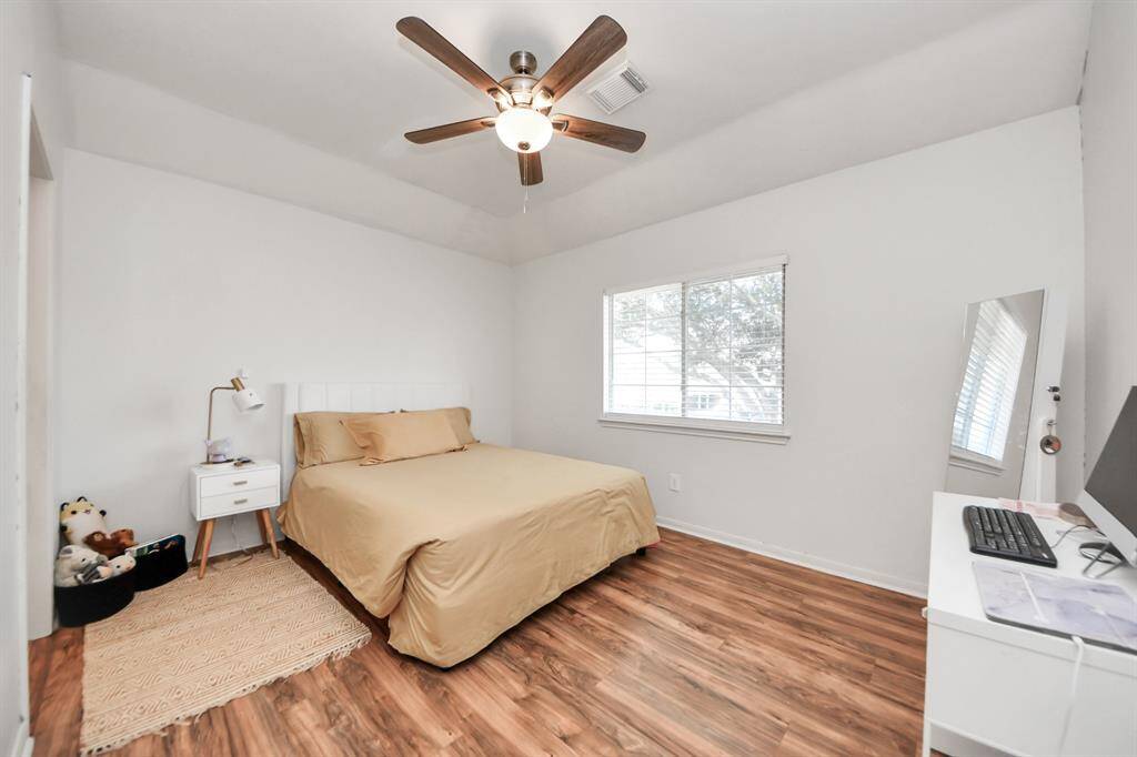 Another spacious guest bedroom upstairs with raised ceiling, shares Jack and Jill bath with adjacent bedroom. Nice walk in closet here also!