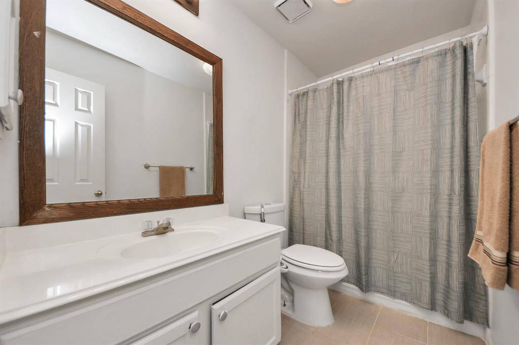 The second upstairs guest bath is easily accessible to the third bedroom and anyone hanging out in the game room.