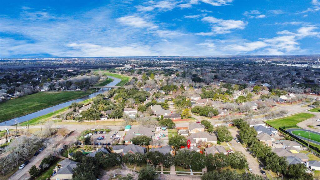 Aerial view shows proximity to the front of the subdivision, where one can easily access 59 South and 99. Easy walk to Dickinson Elementary School too!