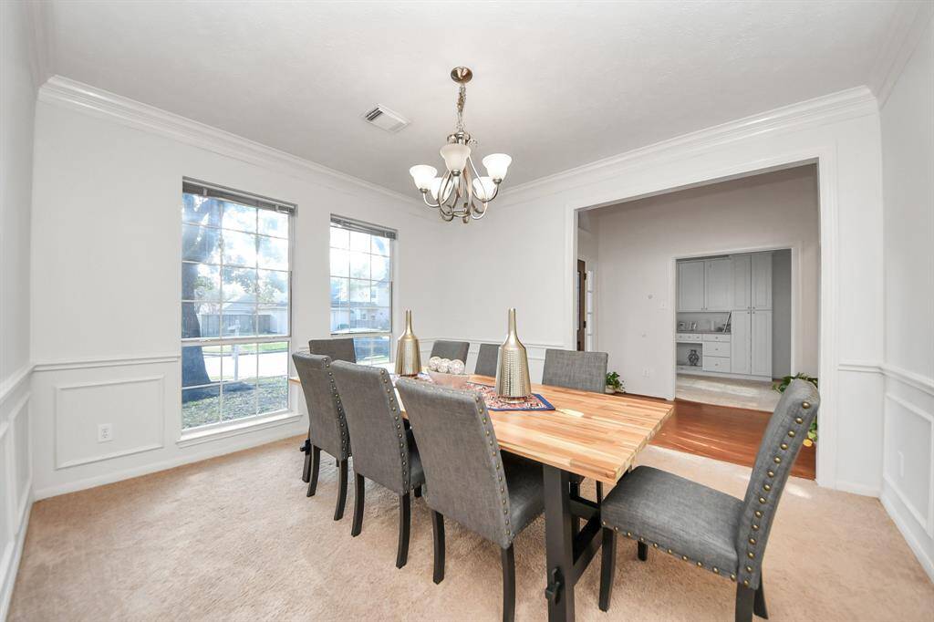 Upon entry, you'll find a soaring two story entry with dining to the right. Natural light bathes this room, adjacent to the kitchen.