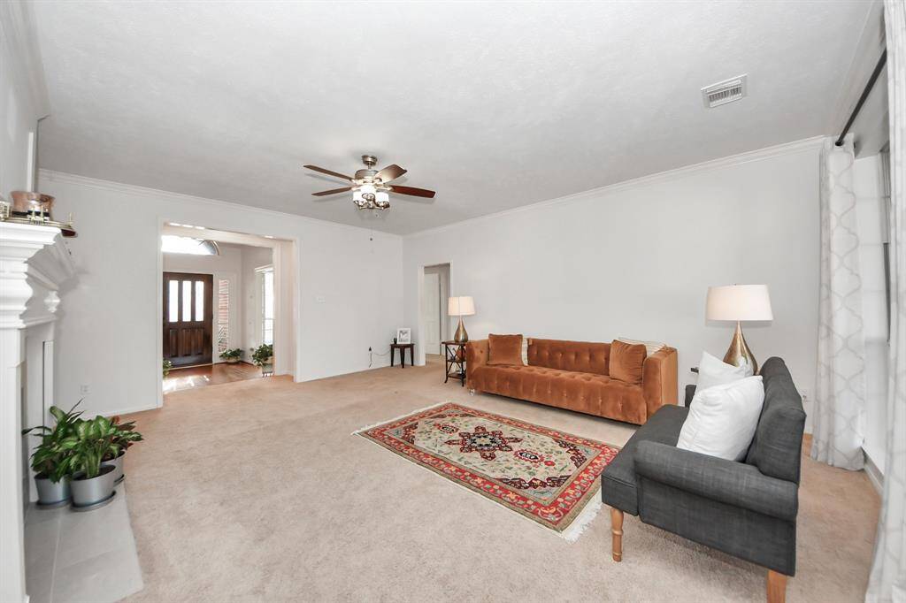 Oversized living room offers a spacious area for versatile seating arrangements.