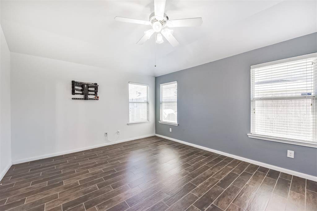 A spacious primary bedroom designed to accommodate your furniture effortlessly, combining comfort and functionality.