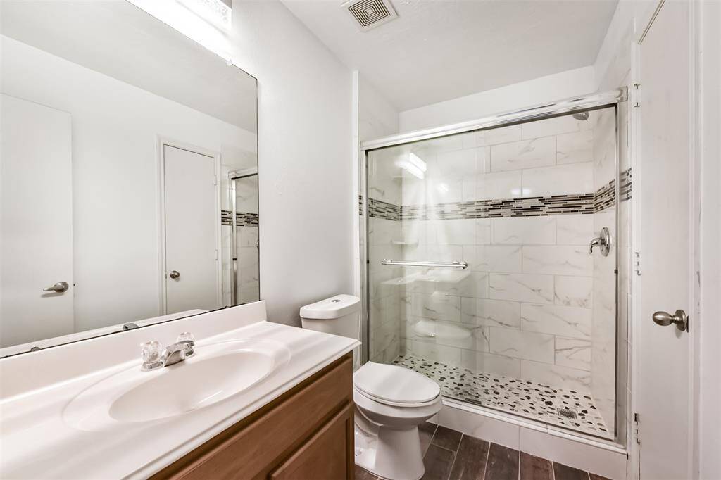 Guest bathroom updated in 2024 with extended shower, tile, and fresh paint.