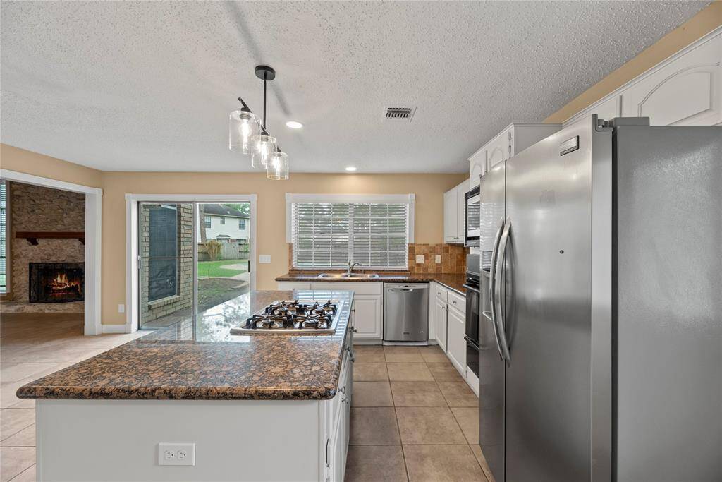 Double glass door leads to the backyard.