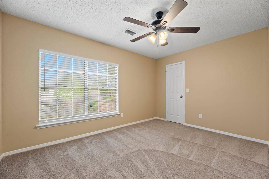 3 upstairs secondary bedrooms include plush carpet, ceiling fans and large closets.