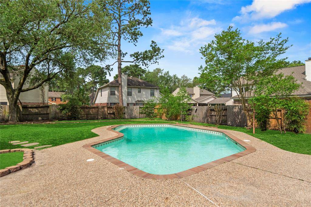 Amazing backyard boasts a refreshing swimming pool!