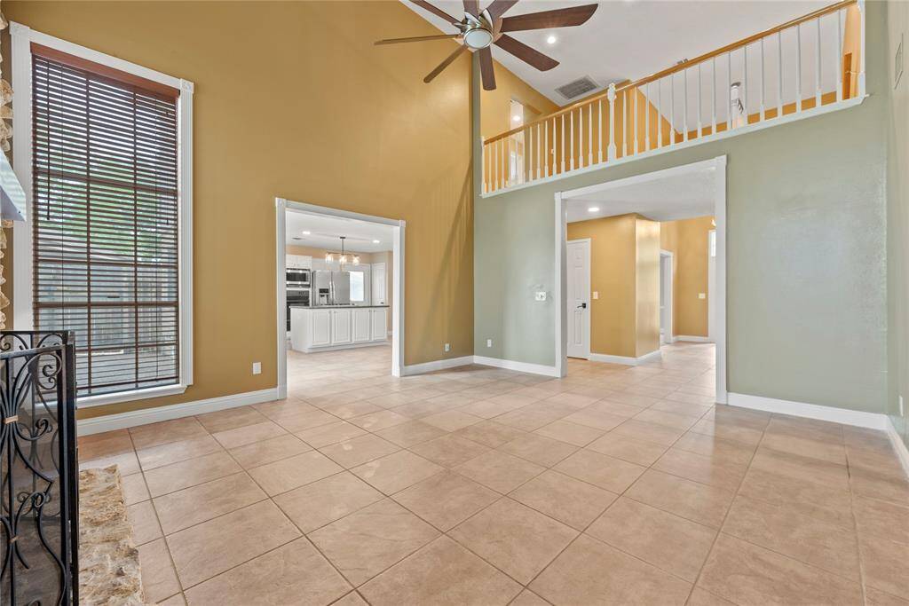 Another view of the family room looking into the kitchen and foyer.