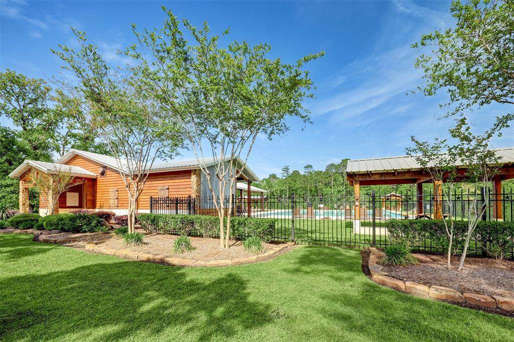 Enjoy the neighborhood clubhouse and pool, overlooking the lake.