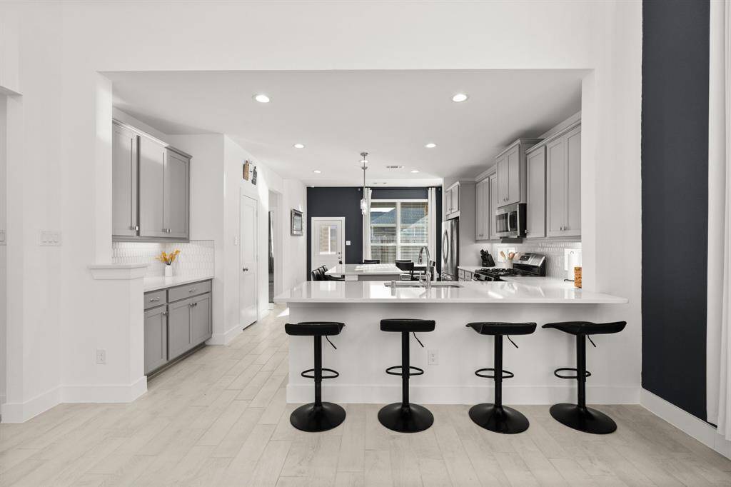 Kitchen opens to living area.