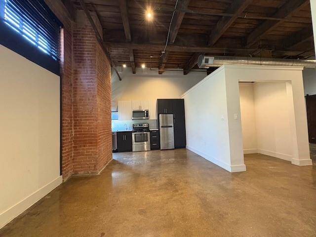 Modern Kitchen in this Warehouse Loft....TONS of Character