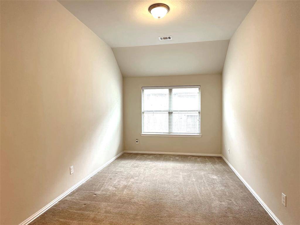 Versatile flex room ideal for a game room, home office, or study space.